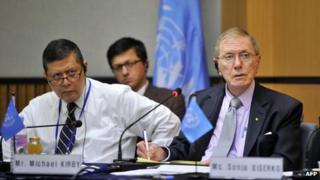 Michael Kirby (R), chairman of the UN Commission of Inquiry on Human Rights in North Korea, and Marzuki Darusman (L), listen to a former North Korean defector (not pictured) during a public hearing at Yonsei University in Seoul on 21 August 2013