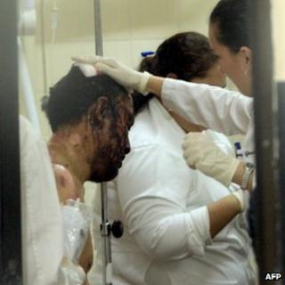 A medic treats a wounded man at the Palmasola jail. Photo: 23 August 2013