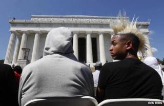 Two young men attend the the 50th anniversary ceremony at the Lincoln Memorial in Washington, 24 August