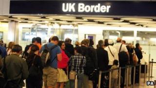 People queuing at airport border control