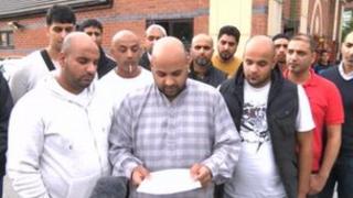Mr Dim's family reading the statement