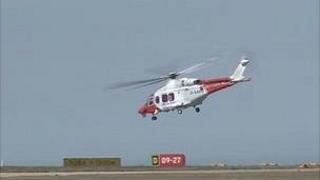 Search and Rescue helicopter taking off after refuelling at Jersey Airport