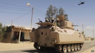 Egyptian Army soldiers patrol in an armoured vehicle ( file picture)