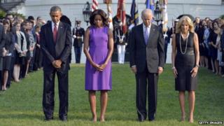US President Barack Obama, First Lady Michelle Obama, Vice-President Joe Biden and Jill Biden observe a moment of silence to mark the 12th anniversary of the 9/11 attacks on the South Lawn of the White House in Washington, DC, on 11 September 2013