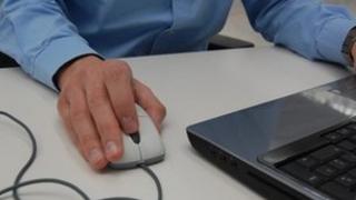 Man using a laptop mouse