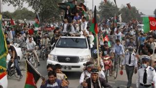 Afghans welcome their national football team a day after they beat India 2-0 in the South Asian Football Federation Championship in Kabul, Afghanistan, on 12 September 2013.