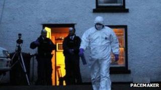 Forensic investigators at the scene of the shooting at the farm in Glenarm