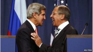 US Secretary of State John Kerry (L) speaks with Russian Foreign Minister Sergey Lavrov (R) before a press conference in Geneva