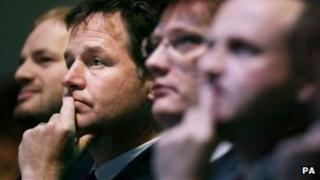 Nick Clegg, Danny Alexander and Steve Webb in the conference hall
