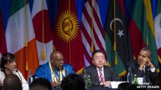 Maina Kiai, United Nations special rapporteur, and US President Barack Obama listen during a United Nations event in New York on 23 September 2013