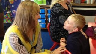 Head of School at Bishop Bronescombe C of E School in St Austell, Katie Dalton, with one of the younger pupils