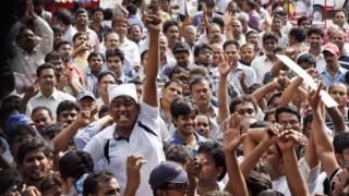 Andhra Pradesh government employee opponents of the creation of a separate state of Telangana carved out from the existing Andhra Pradesh state raise slogans during a meeting in Hyderabad, India, Saturday, Sept. 7, 2013.