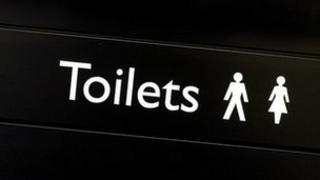 Public toilets sign