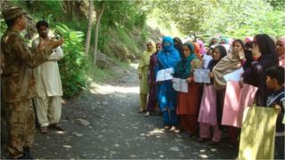 Protesters in the Neelum valley facing off against a soldier