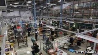 Looking into a factory with people at work