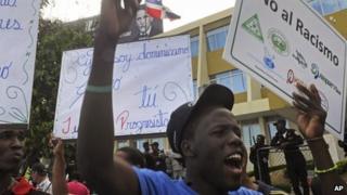 Demonstrators of Haitian descent protest outside the Constitutional Court in Santo Domingo, Dominican Republic on 2 October, 2013
