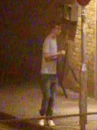 CCTV image of man with chair