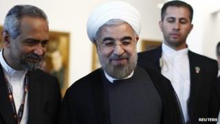 Iran's President Rohani smiles as he walks after speaking in a High-Level Meeting on Nuclear Disarmament during the 68th United Nations General Assembly at U.N. headquarters in New York