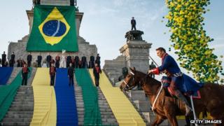An actor plays the role of Pedro I in front of the independence monument in Sao Paulo on 2 September, 2012