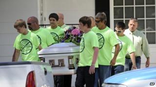Pallbearers wearing anti-bullying t-shirts carried the casket of Rebecca Sedwick in Florida on 16 September 2013