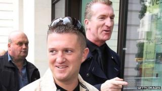 English Defence League leaders Tommy Robinson (C) and Kevin Carroll arrive at Westminster Magistrates Court