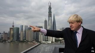 London Mayor Boris Johnson views the Shanghai skyline from The Bund as he arrives in the Chinese city for the second part of a week long visit to China to promote trade between the far east and London, 16 October 2013