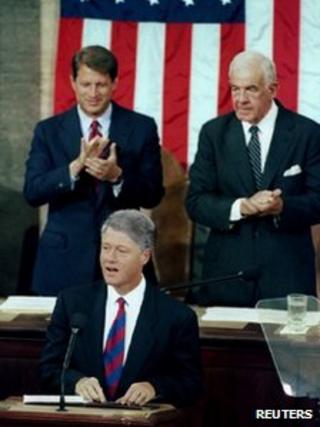 US President Clinton is applauded by Vice President Al Gore and House Speaker Tom Foley (r) as he addresses a joint session of Congress on 22 September 1993
