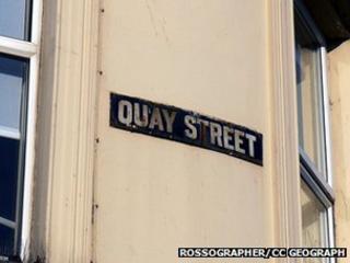 Old enamel street sign on a building at the corner of Quay Street, Bangor