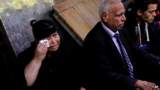 Mourners at the funerals of the victims of Sunday's church attack in Cairo (21 October 2013)