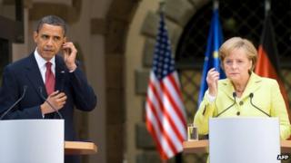 This picture taken on June 5, 2009 shows US President Barack Obama and German Chancellor Angela Merkel listening to translations during a press conference at Dresden Castle in the centre of the eastern German town of Dresden