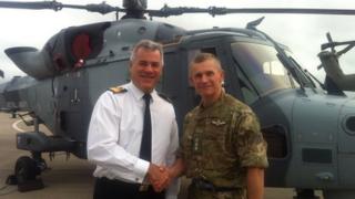 Commodore jock Alexander of RNAS Yeovilton and Col Neil Dalton from the army's Aviation Reconnaissance Force with a Wildcat helicopter behind them