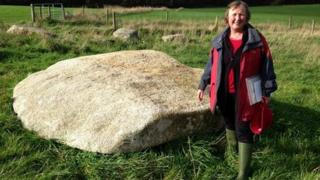 Pip Richards from the Sustainable Trust with the quoit's capstone