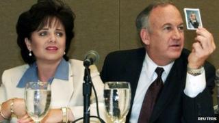 Patsy Ramsey and her husband, John Ramsey, produce a picture of JonBenet Ramsey during a press conference where they released the results of an independent lie detector test in Atlanta 24 May 2000