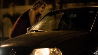 Brazilian prostitute talking to client