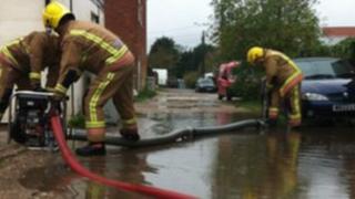 Fire crews pumping water