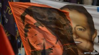 Flags with the faces of President Cristina Fernandez de Kirchner and Martin Insaurralde are seen during the closing of the election campaign in Buenos Aires province on 24 October, 2013