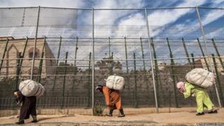 Women carrying loads at the border crossing