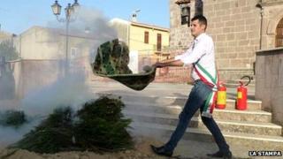Francesco Mura makes his smoke signal protest