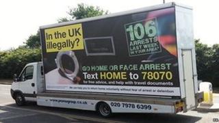 Home Office van bearing the slogan "In the UK illegally? Go home or face arrest"