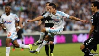 Olympique Marseille's Florian Thauvin shoots and scores against Reims during their French Ligue 1 soccer match at the Velodrome stadium in Marseille on 26 October 2013