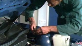 Mechanic working on car