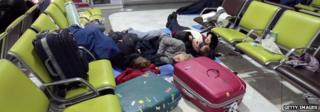 Passengers sleeping on the ground at Charles de Gaulle Airport in December 2009 when snow caused cancellations and delays