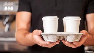 Barista with coffee tray