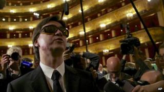 Artistic director of the Bolshoi ballet Sergei Filin, left, speaks to the media after a traditional annual meeting of the Bolshoi Theatre in Moscow, Russia, Tuesday, 17 Sept 2013