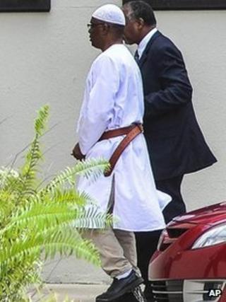 William Potts, left, is led into FBI headquarters in North Miami Beach, Florida, 6 November 2013