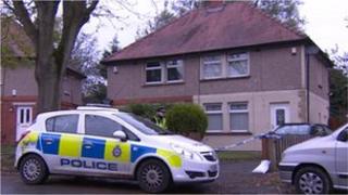 Police car and ribbon outside house in Wood Lane, Swain House, Bradford