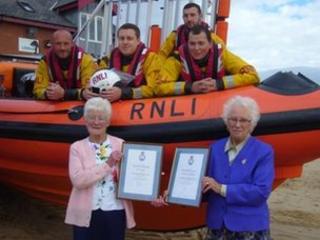 Jen Taylor and Kathy Blackman with RNLI crew