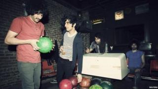 Members of the Yellow Dogs, (L-R) Soroush Farazmand, Koory Mirz, Siavash Karampour and Arash Farazmand are shown at The Gutter bowling alley in Williamsburg neighbourhood in New York in 2011