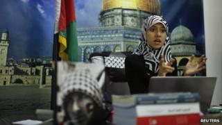Isra al-Modallal in her office in Gaza (11 November 2013)