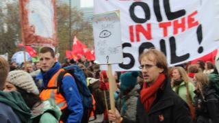 Protesters marching in Warsaw demanded rapid action on climate change